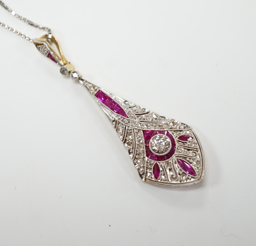 A Belle Époque pierced yellow metal, pink sapphire and diamond cluster set drop pendant, 44mm, on a later 9ct white gold chain, 44cm, gross weight 5.2 grams. Good condition.